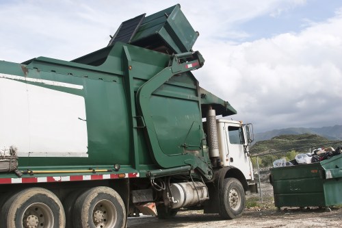 Front view of skip hire truck at a residential site